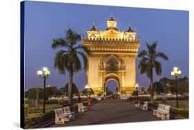 Laos, Vientiane. Patuxai, Victory Monument exterior at dusk.-Walter Bibikow-Stretched Canvas