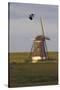 Lapwing (Vanellus Vanellus) Flying Past Windmill, Texel, Netherlands, May 2009-Peltomäki-Stretched Canvas