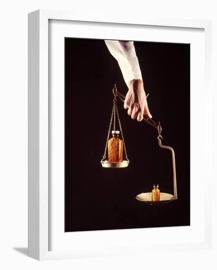 Large and Small Bottles of Generic Pills Being Weighed on Balance Scale-Bill Eppridge-Framed Photographic Print