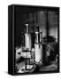 Large Cylinders, One W Man on Top Climbing Ladder at Westinghouse Plant-Alfred Eisenstaedt-Framed Stretched Canvas