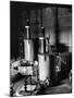 Large Cylinders, One W Man on Top Climbing Ladder at Westinghouse Plant-Alfred Eisenstaedt-Mounted Photographic Print