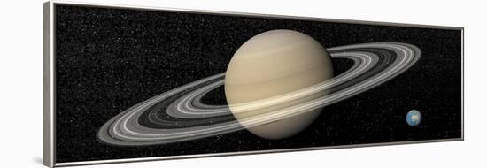 Large Planet Saturn and its Rings Next to Small Planet Earth-null-Framed Art Print