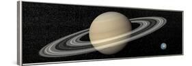 Large Planet Saturn and its Rings Next to Small Planet Earth-null-Framed Art Print