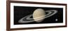 Large Planet Saturn and its Rings Next to Small Planet Earth-null-Framed Art Print