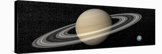 Large Planet Saturn and its Rings Next to Small Planet Earth-null-Stretched Canvas