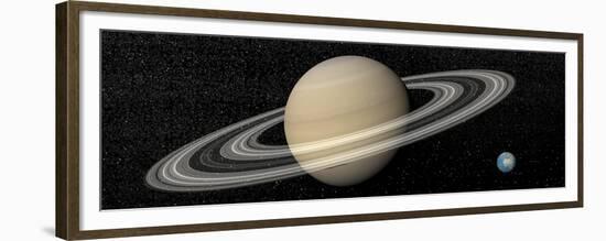 Large Planet Saturn and its Rings Next to Small Planet Earth-null-Framed Premium Giclee Print