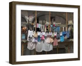 Large Quantity of Laundry Hanging from the Balcony of a Crumbling Building, Habana Vieja, Cuba-Eitan Simanor-Framed Photographic Print