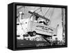 Large Transport Truck Bed Dangling in Midair-null-Framed Stretched Canvas