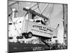 Large Transport Truck Bed Dangling in Midair-null-Mounted Photographic Print