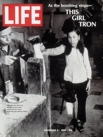 12-Year-Old Vietnamese Girl Nguyen Thi Tron Watching New Wooden Leg Being Made, November 8, 1968