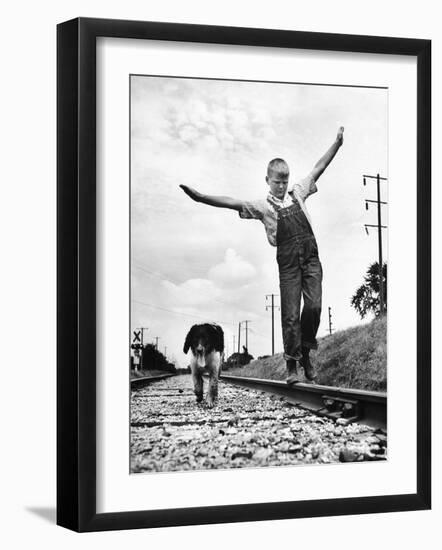 Larry Jim Holm with Dunk, His Spaniel Collie Mix, Walking Rail of Railroad Tracks in Rural Area-Myron Davis-Framed Photographic Print