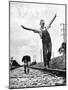 Larry Jim Holm with Dunk, His Spaniel Collie Mix, Walking Rail of Railroad Tracks in Rural Area-Myron Davis-Mounted Photographic Print