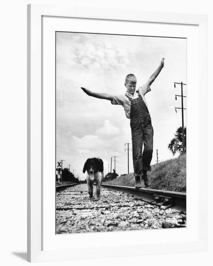 Larry Jim Holm with Dunk, His Spaniel Collie Mix, Walking Rail of Railroad Tracks in Rural Area-Myron Davis-Framed Photographic Print