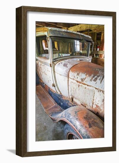 Latah, Washington State, USA. Rusted vintage Ford Model A pickup truck in a barn-Emily Wilson-Framed Photographic Print