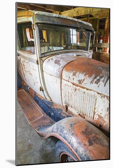 Latah, Washington State, USA. Rusted vintage Ford Model A pickup truck in a barn-Emily Wilson-Mounted Photographic Print