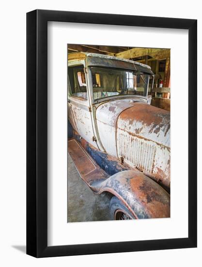 Latah, Washington State, USA. Rusted vintage Ford Model A pickup truck in a barn-Emily Wilson-Framed Photographic Print