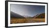 Late afternoon sun over a long straight road into the mountains, South Island, New Zealand, Pacific-Logan Brown-Framed Photographic Print