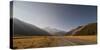 Late afternoon sun over a long straight road into the mountains, South Island, New Zealand, Pacific-Logan Brown-Stretched Canvas