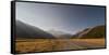 Late afternoon sun over a long straight road into the mountains, South Island, New Zealand, Pacific-Logan Brown-Framed Stretched Canvas