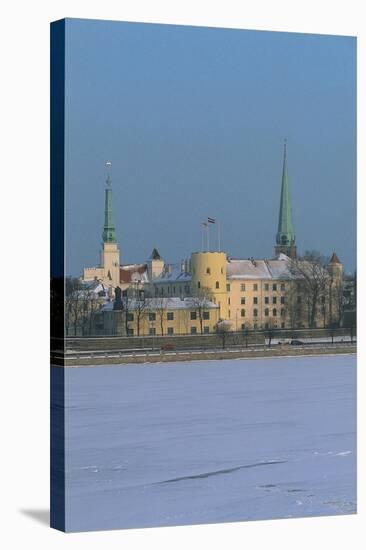 Latvia, Riga Historic Centre, Rigas Pils as Seen from Vansu Bridge with Spire of St James Cathedral-null-Stretched Canvas