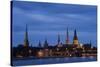 Latvia, Riga, Western Daugava River and Spires of Old Town, Illuminated at Night-null-Stretched Canvas