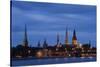 Latvia, Riga, Western Daugava River and Spires of Old Town, Illuminated at Night-null-Stretched Canvas