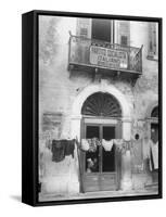 Laundry Hanging in Front of Local Headquarters-Walter Sanders-Framed Stretched Canvas