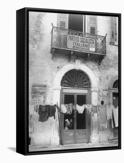 Laundry Hanging in Front of Local Headquarters-Walter Sanders-Framed Stretched Canvas