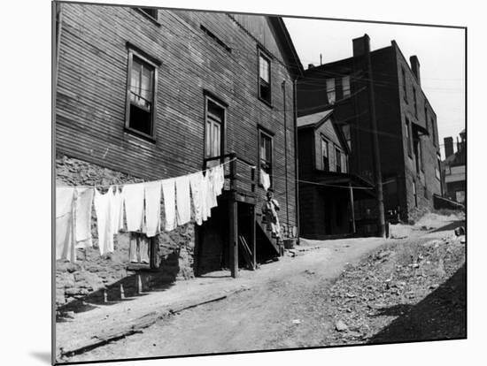 Laundry on Clothesline Hanging Along Wall of Wooden House in Worker Housing in Steel Town-Alfred Eisenstaedt-Mounted Premium Photographic Print