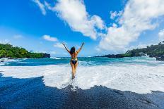 Woman enjoying the sun on one of Maui's black sand beaches, Hawaii-Laura Grier-Photographic Print