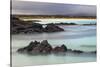 Lava rocks along tranquil shoreline of San Cristobal Island, Galapagos, Ecuador.-Adam Jones-Stretched Canvas