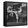 Law Student Gojuro Harada Uses Right Foot on the stomach to ward off attack of economics student-John Florea-Framed Stretched Canvas