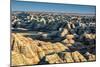 Layers of hoodoo peaks stretching into a flat landscape at the horizon.-Sheila Haddad-Mounted Photographic Print