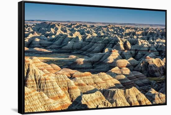 Layers of hoodoo peaks stretching into a flat landscape at the horizon.-Sheila Haddad-Framed Stretched Canvas