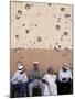 Lebanese Residents Rest in Front of a Wall-null-Mounted Photographic Print