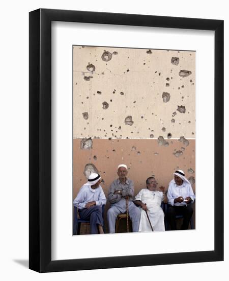 Lebanese Residents Rest in Front of a Wall-null-Framed Photographic Print