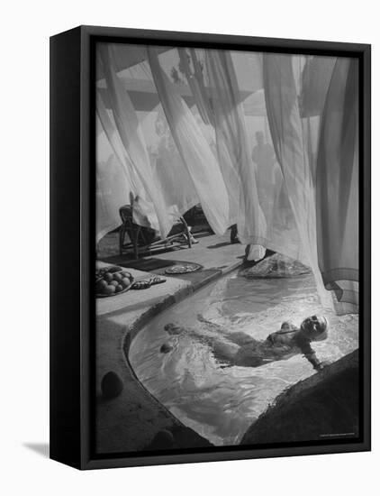 Lee Anderson Swimming Into Living Room of Raymond Loewy's House-Peter Stackpole-Framed Stretched Canvas