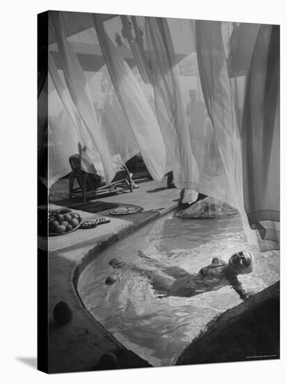 Lee Anderson Swimming Into Living Room of Raymond Loewy's House-Peter Stackpole-Stretched Canvas