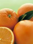 Oranges with Leaves Close Up-Leigh Beisch-Photographic Print