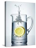 Lemon Falling into Jug of Water-Petr Gross-Stretched Canvas