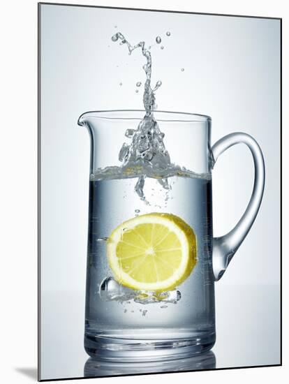 Lemon Falling into Jug of Water-Petr Gross-Mounted Photographic Print