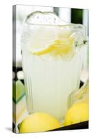 Lemonade in a Glass Jug with Slices of Lemon-Foodcollection-Stretched Canvas