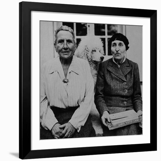 Lesbian Authors Gertrude Stein and Alice B. Toklas with their Poodle Basket II-Carl Mydans-Framed Premium Photographic Print