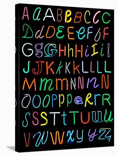 Letters Of The Alphabet Made From Neon Signs-Karimala-Stretched Canvas