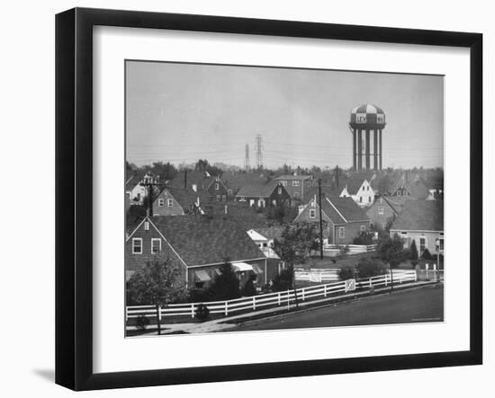 Levittown Water Tank Looming over Middle Class Homes in New Housing Development-Joe Scherschel-Framed Photographic Print