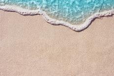 Soft Wave of Blue Ocean on Sandy Beach. Background. Selective Focus.-Lidiya Oleandra-Framed Stretched Canvas