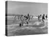 Lifeguards and Members of Womens Swimming Team Start Day by Charging into Surf-Peter Stackpole-Stretched Canvas