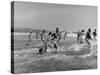 Lifeguards and Members of Womens Swimming Team Start Day by Charging into Surf-Peter Stackpole-Stretched Canvas