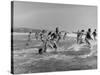 Lifeguards and Members of Womens Swimming Team Start Day by Charging into Surf-Peter Stackpole-Stretched Canvas