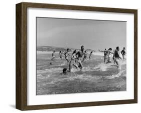 Lifeguards and Members of Womens Swimming Team Start Day by Charging into Surf-Peter Stackpole-Framed Photographic Print